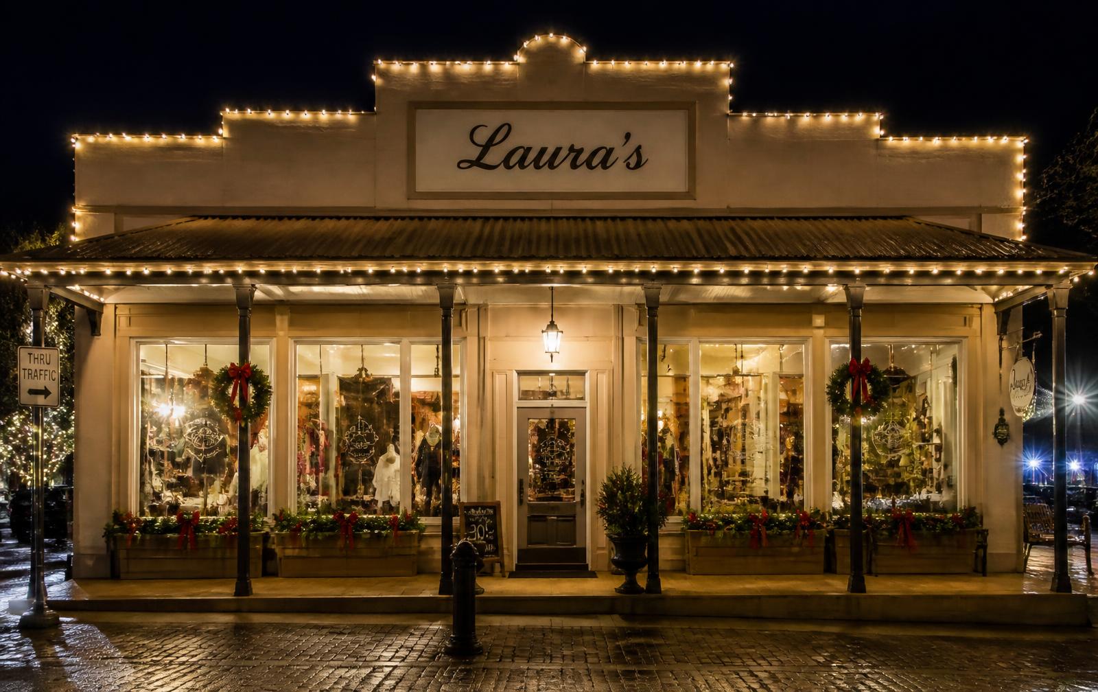 Storefront outlined in warm white holiday lights